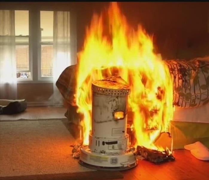 Space heater that is on fire.