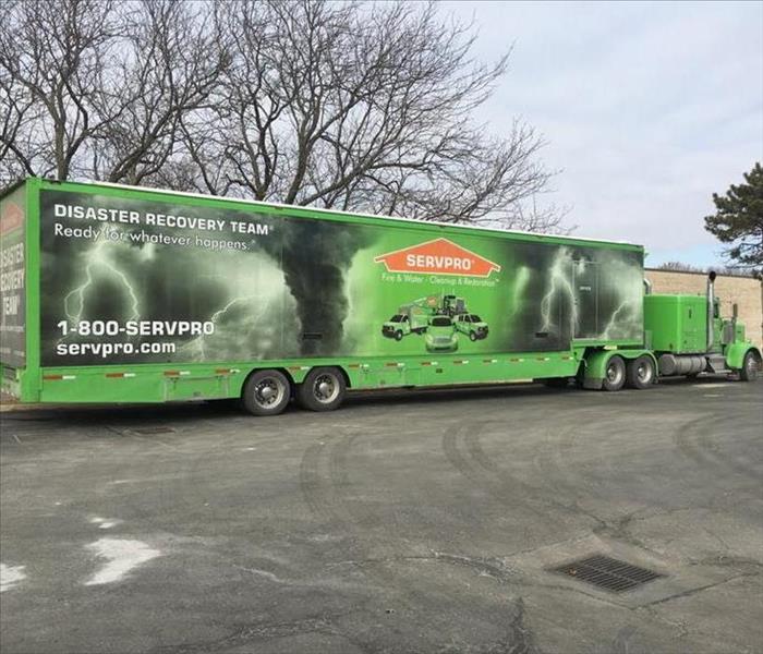 SERVPRO green Disaster Recovery Team trailer in parking lot.  